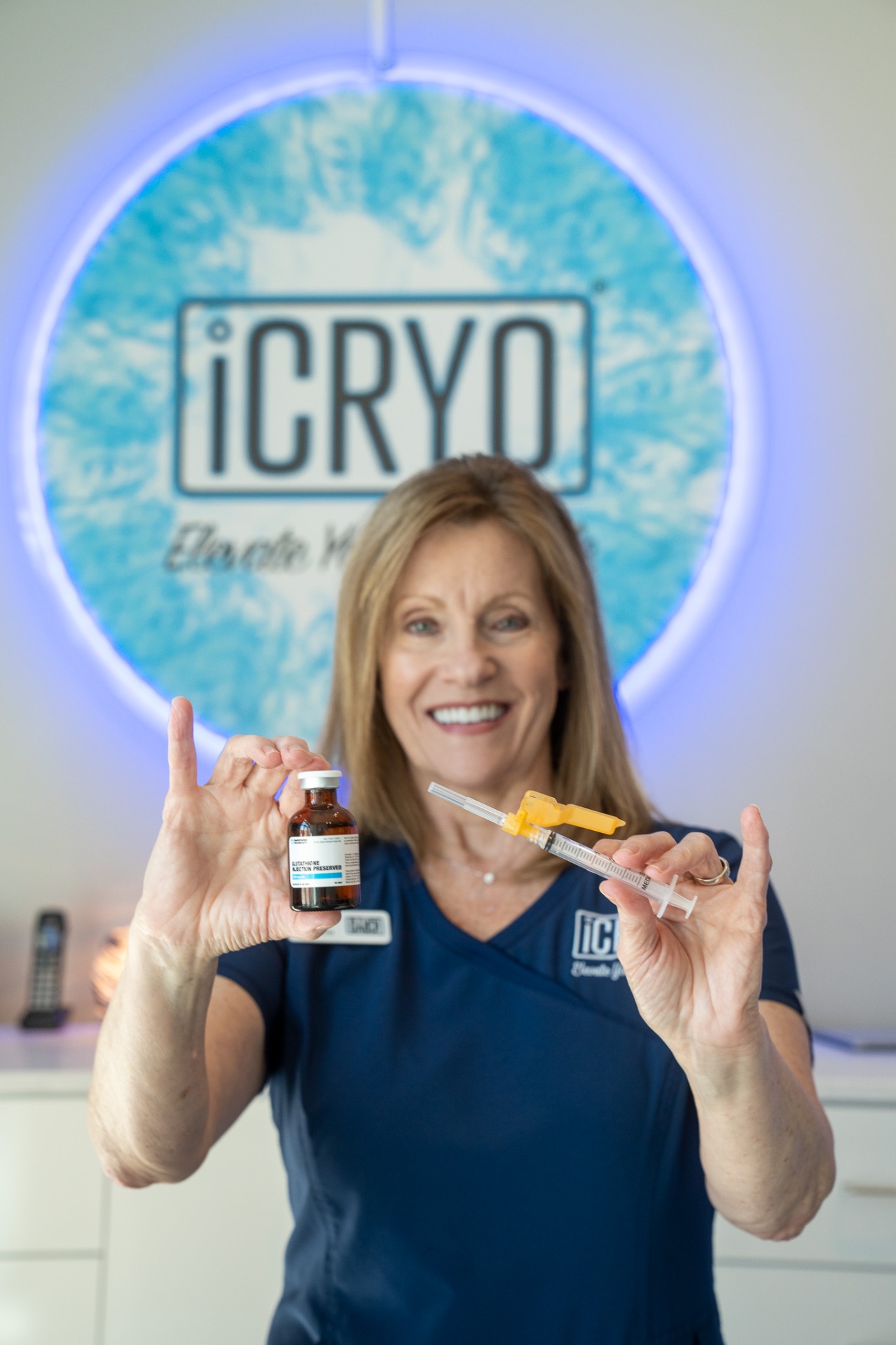 iCRYO SouthPark registered nurse holding glutathione IM shot vial and syringe