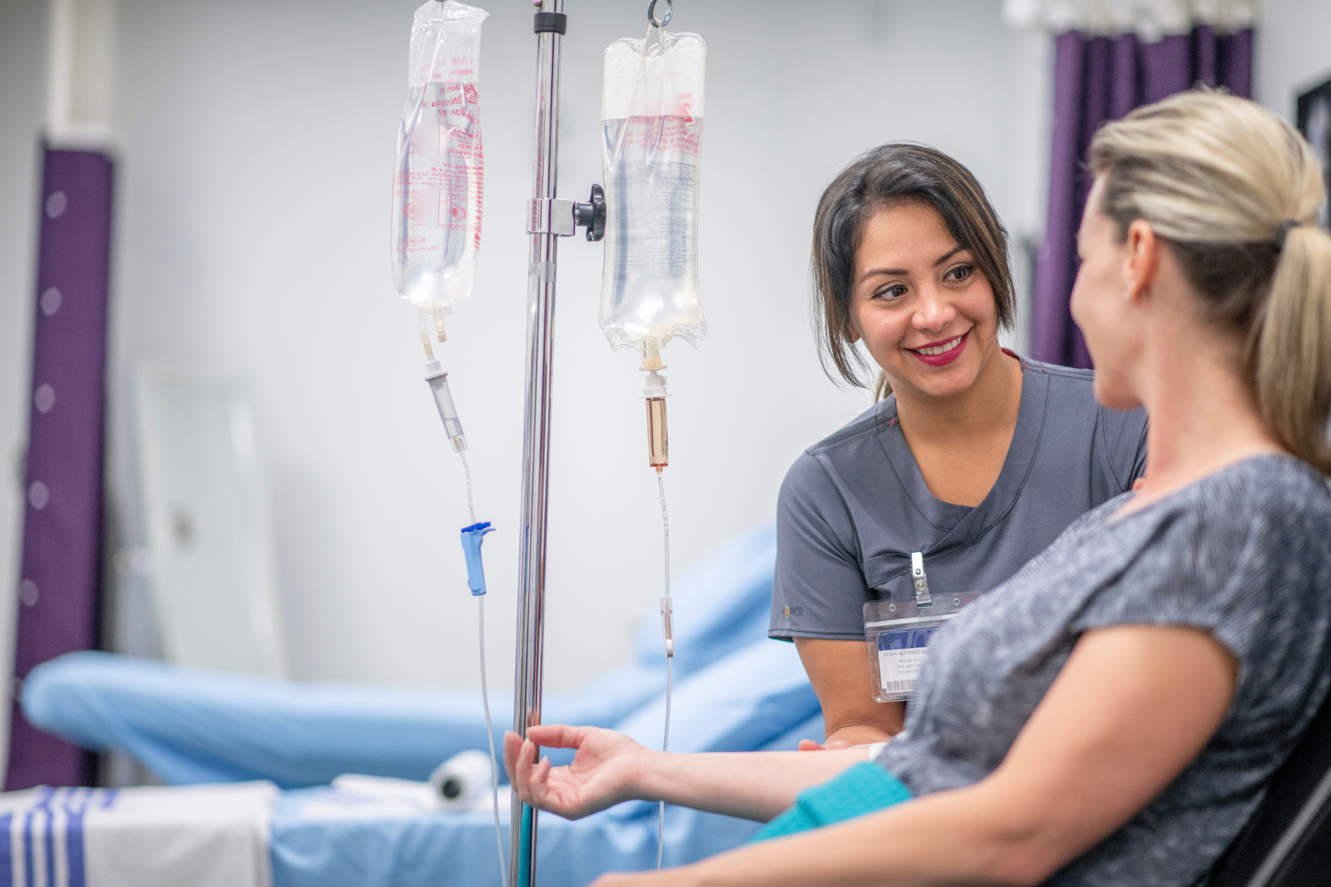 Registered Nurse with a guest during a stem cell IV infusion at iCRYO SouthPark